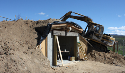 Jeff backfilled the walls and covered over the roof and the first phase of construction was complete.